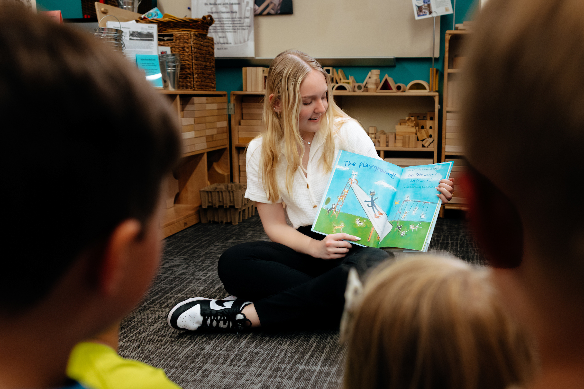 Reading to students in classroom 