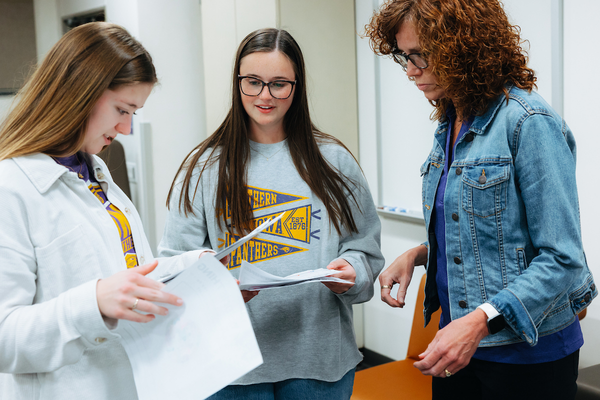 Faculty member Audra Hootman with two elementary ed students