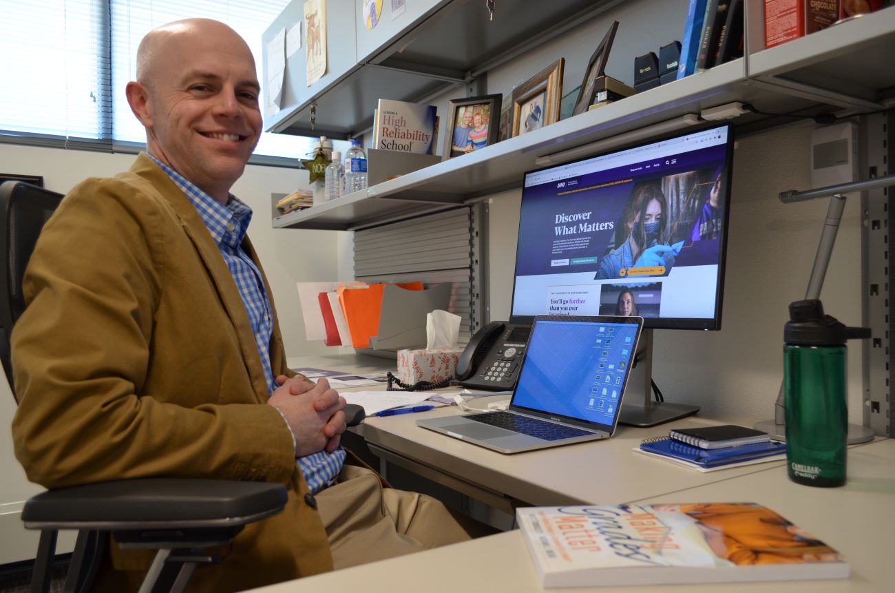 Matt Townsley in office at desk