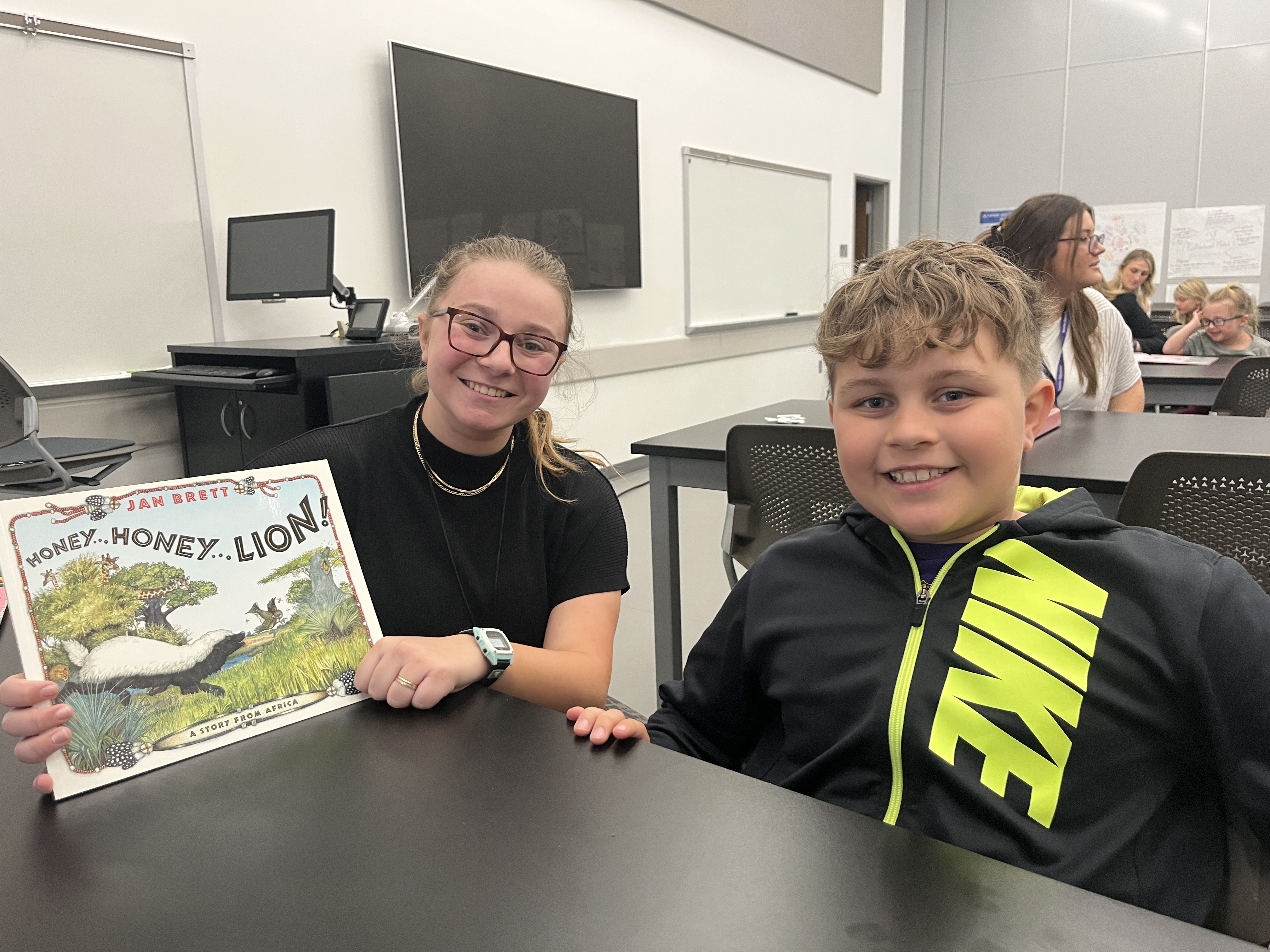 Student tutoring child at Literacy Clinic