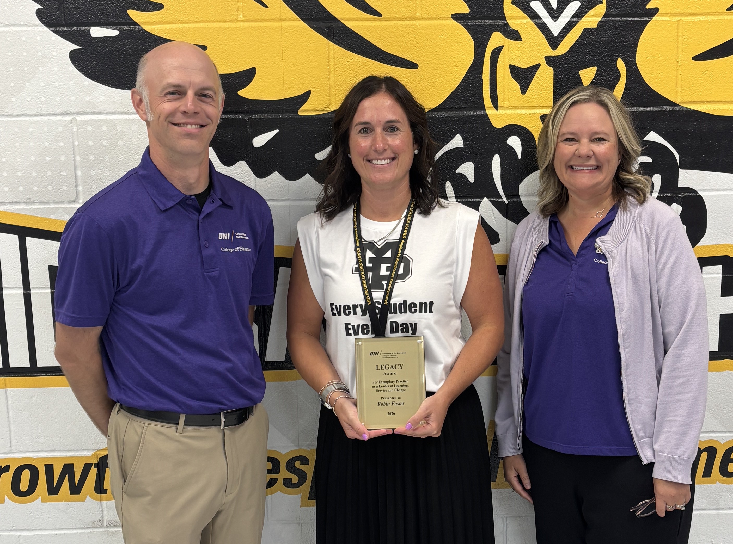 Matt Townsley and Mary Sult awarding Robin Foster the Legacy Award
