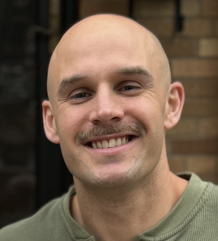 Bald man smiling