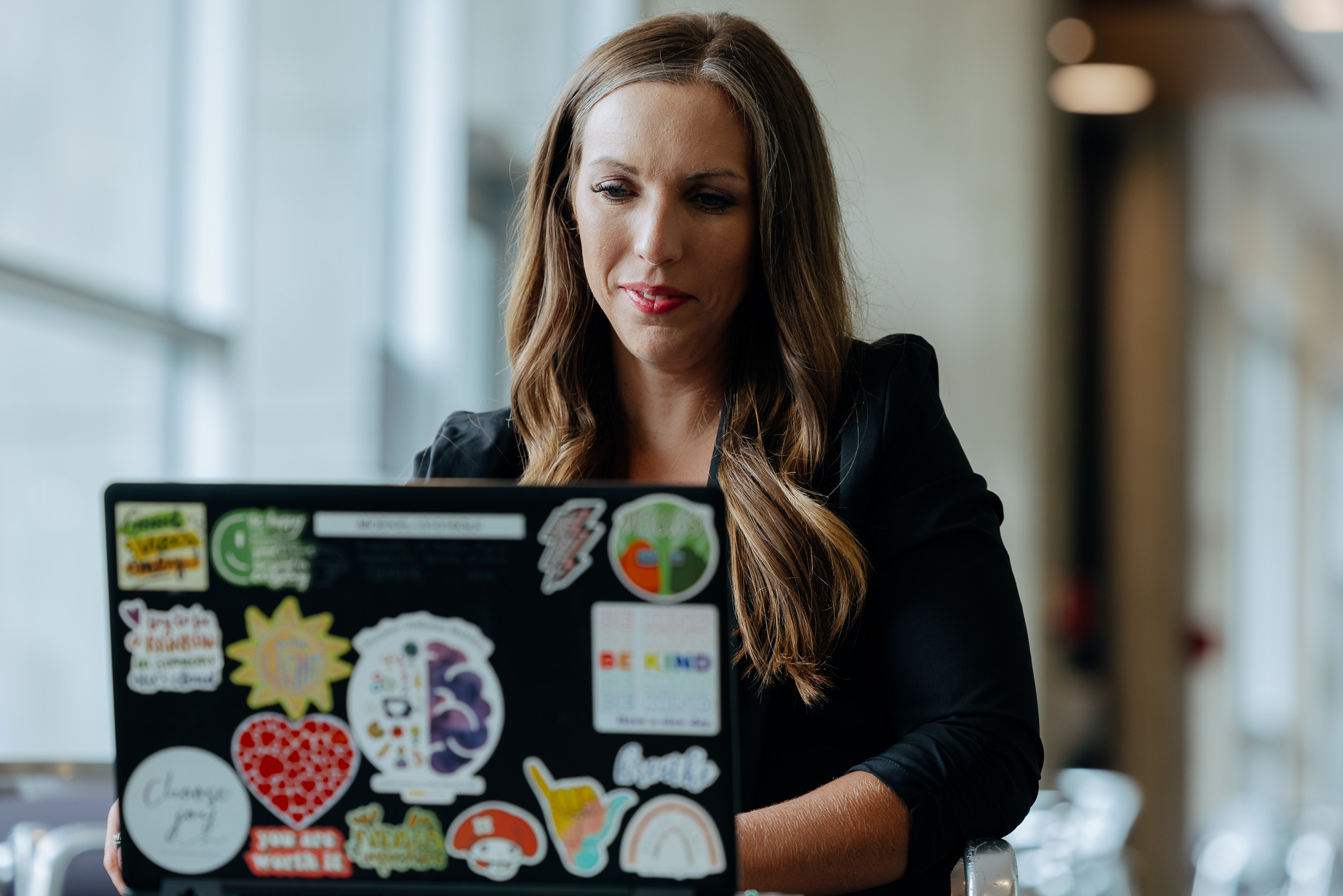 Online principalship student on computer
