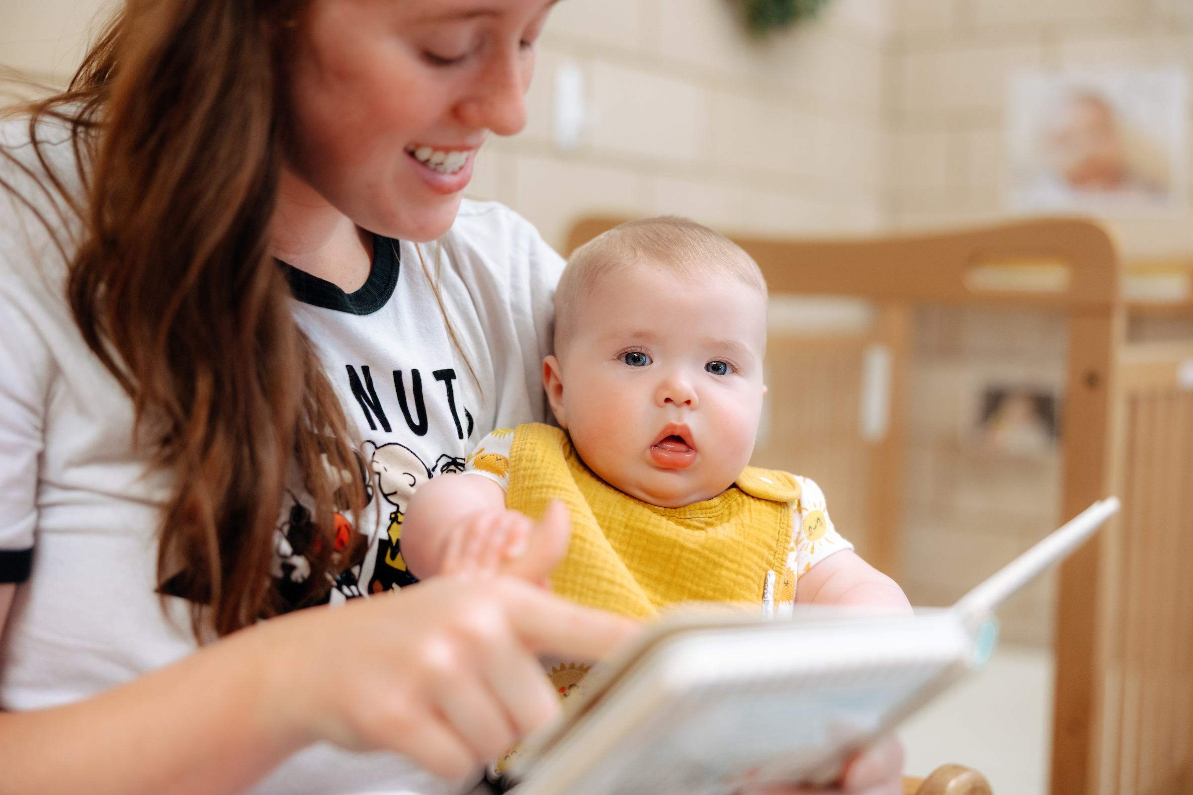 Teacher reads to baby 