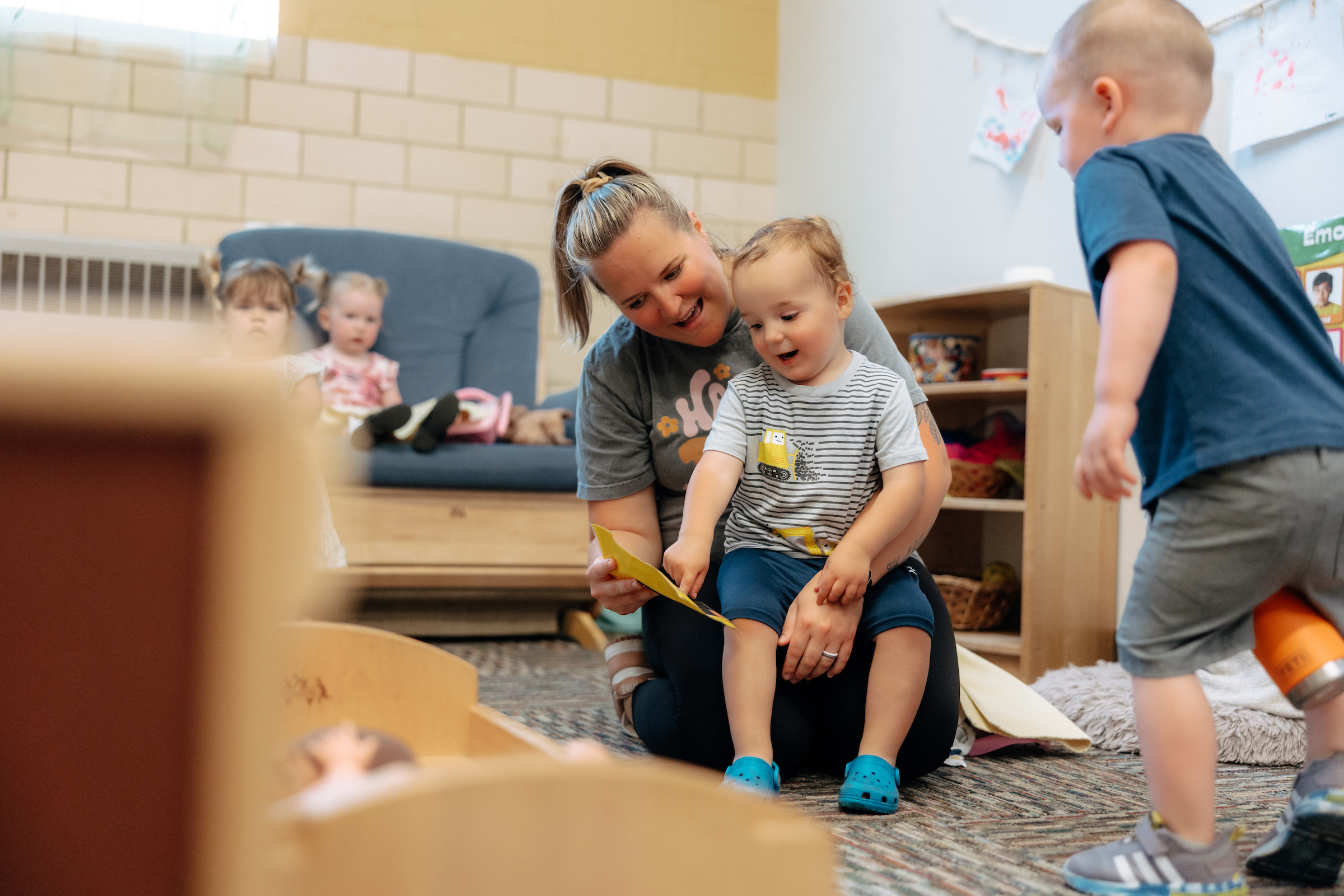 Teacher reading to toddler