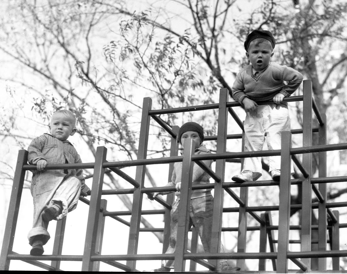 Historical photo of children on jungle gym