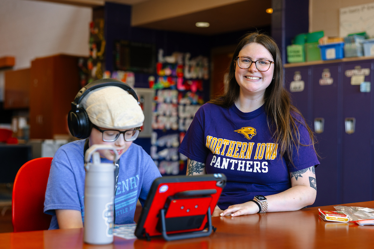 Student teacher working with student in special education classroom 
