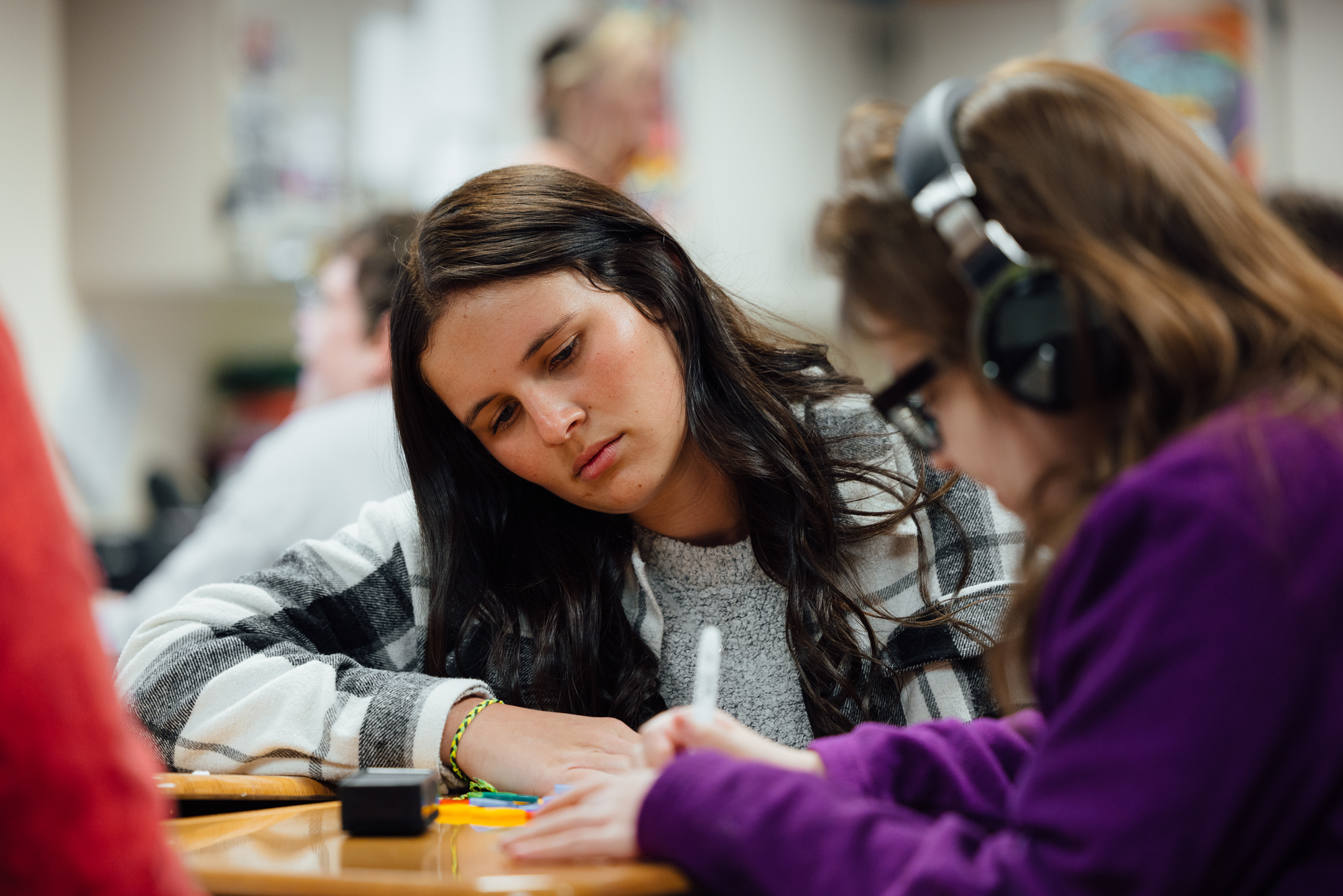 Student with student in high school special education class