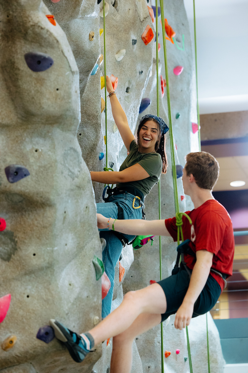 Graduate recreation students on rock wall