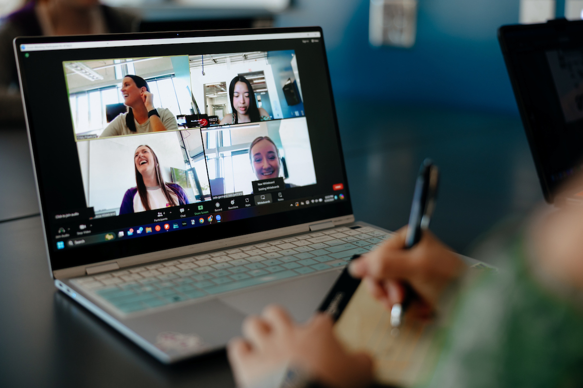 Student online with class discussion