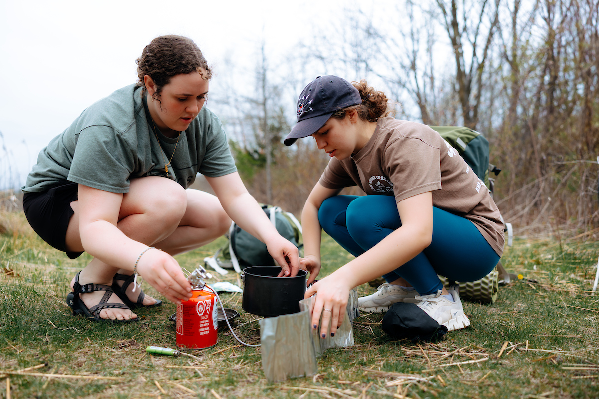 Outdoor education students getting ready to cook 