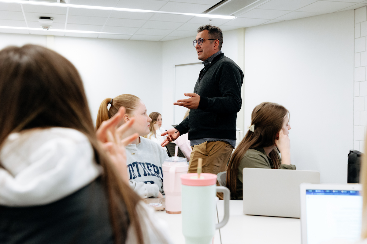 Professor leading classroom discussion