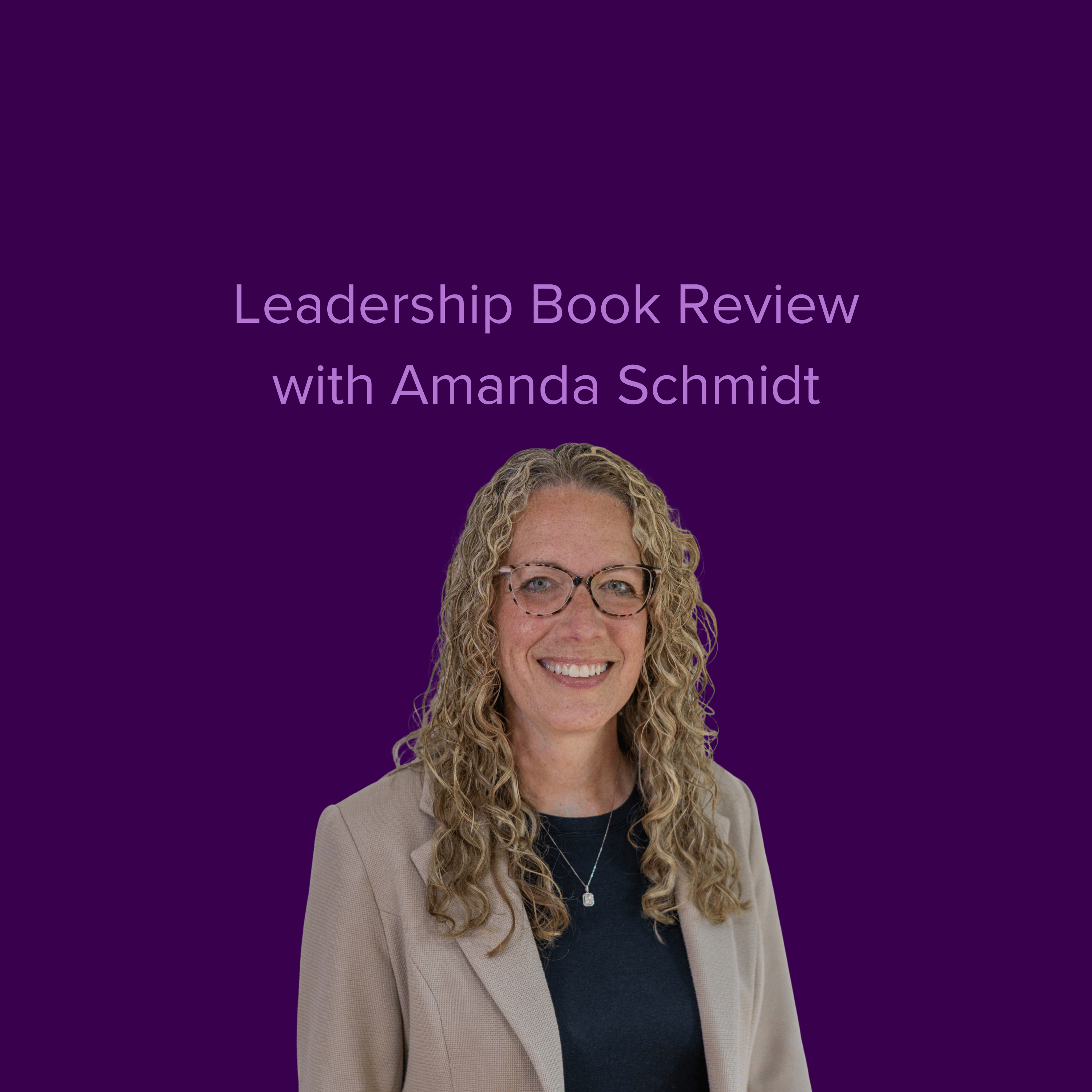 Image of Amanda Schmidt wearing a necklace, blazer and glasses