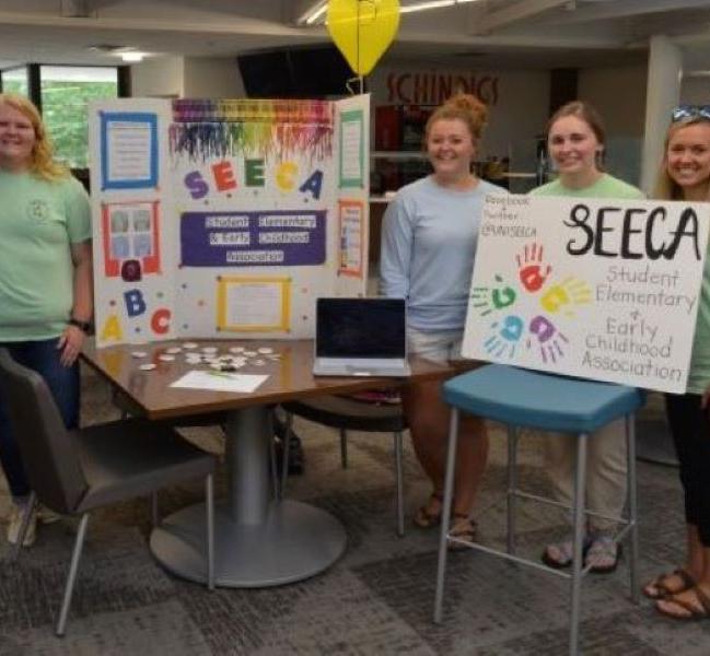 Student organization booth highlighting SEECA.