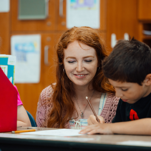 School psychology student working with kids in class 